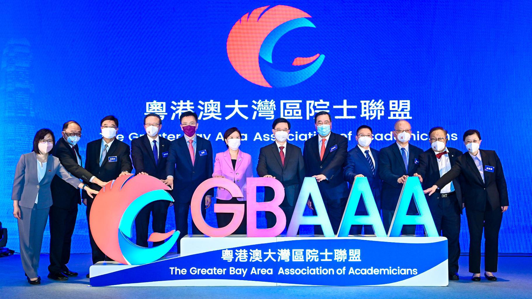 A group of people posing for a photo

Description automatically generated